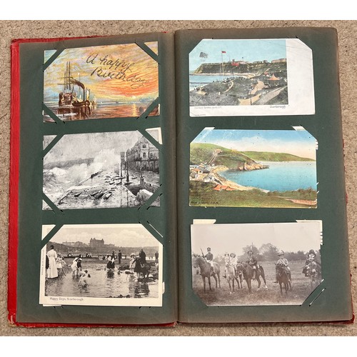 915 - An Edwardian postcard album containing a variety of subjects, Scarborough Wreck of Spa Wall and othe... 