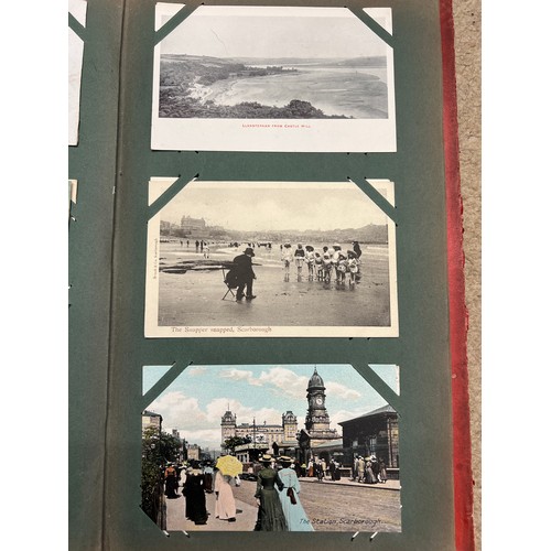 915 - An Edwardian postcard album containing a variety of subjects, Scarborough Wreck of Spa Wall and othe... 