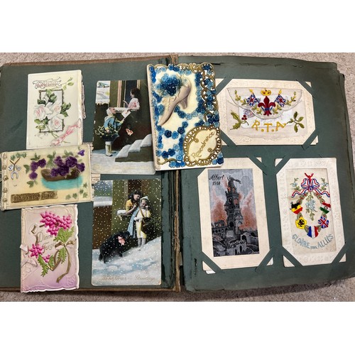 916 - An Edwardian postcard album and contents to include a quantity of WW1 silk embroidered examples, WW1... 