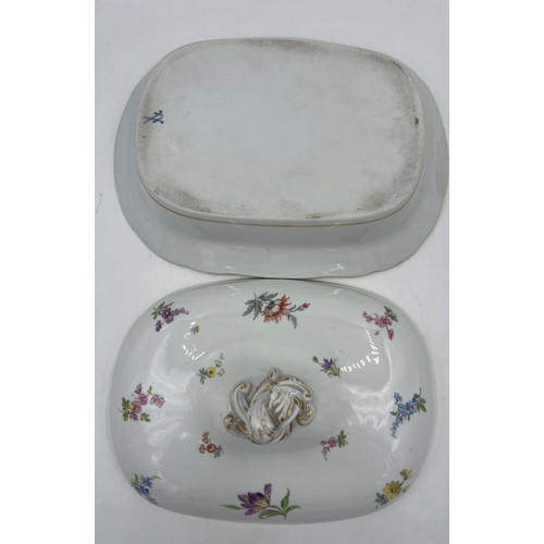 162 - A 19thC Dresden lidded tureen with hand painted sprigs of flowers. 30cm x 22cm approximately.