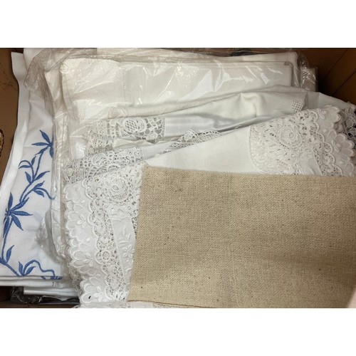 848 - A large quantity, in two boxes, of linen and lace to include pillow slips, bedcovers, lace collars, ... 