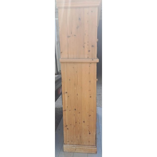 50 - Two pine cupboards, two glazed doors to top over two solid doors to base, with labels for John Smith... 