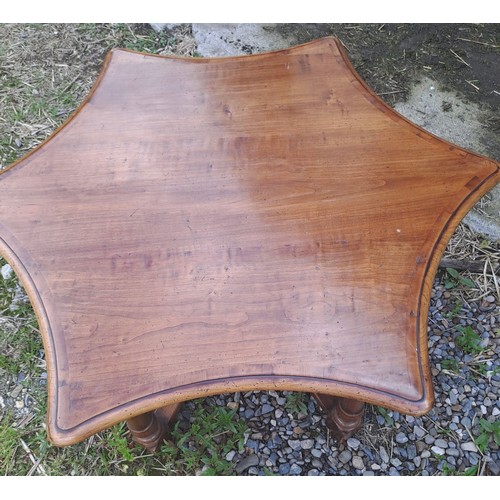 54 - A star shaped hardwood table. 48cm h x 118cm x 90cm.