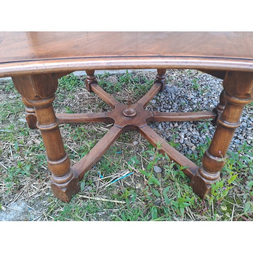 54 - A star shaped hardwood table. 48cm h x 118cm x 90cm.