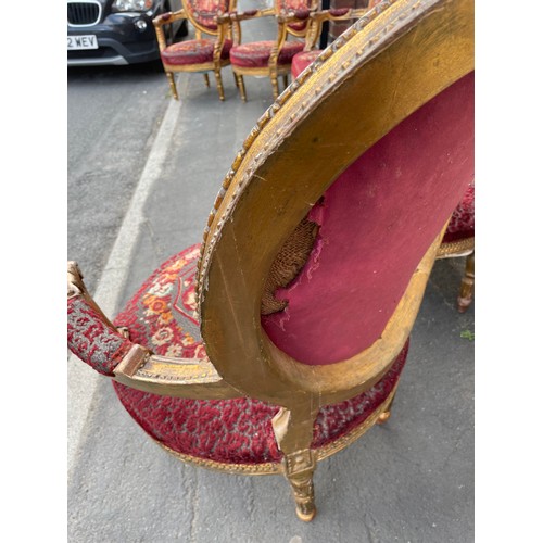 45 - A Victorian carved giltwood salon suite comprising 3 seater plus 4 open armchairs. Turned reeded leg... 