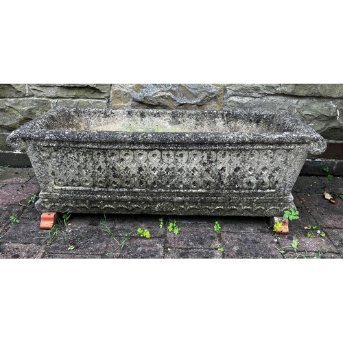 25 - A reconstituted stone garden trough. Approximately 45cm d x 92cm w.