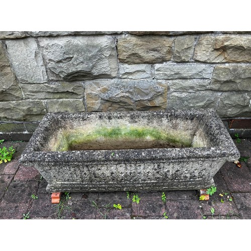 25 - A reconstituted stone garden trough. Approximately 45cm d x 92cm w.