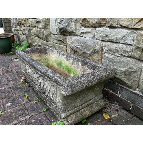 25 - A reconstituted stone garden trough. Approximately 45cm d x 92cm w.