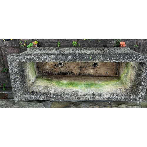 25 - A reconstituted stone garden trough. Approximately 45cm d x 92cm w.