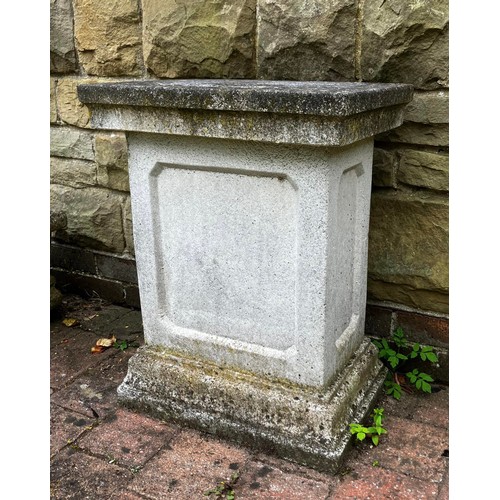 26 - A reconstituted stone plinth. Approximately 66cm h. Top 50cm w.