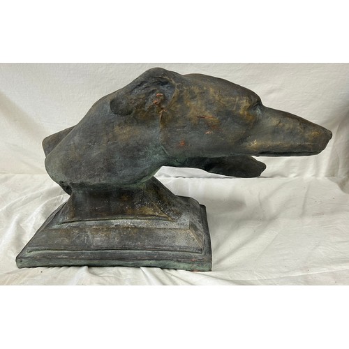 31 - A reconstituted stone sculpture depicting two greyhounds. Base 29cm x 21cm. Length to nose 46cm. Hei... 