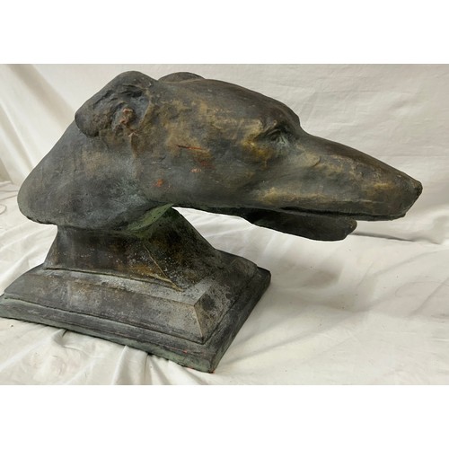 31 - A reconstituted stone sculpture depicting two greyhounds. Base 29cm x 21cm. Length to nose 46cm. Hei... 