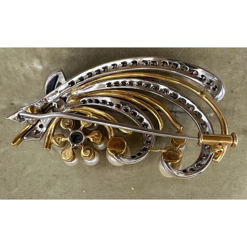 599 - An 18 carat white and yellow gold brooch set with diamonds, pearls and sapphires. 4.5cm x 2.5cm. In ... 