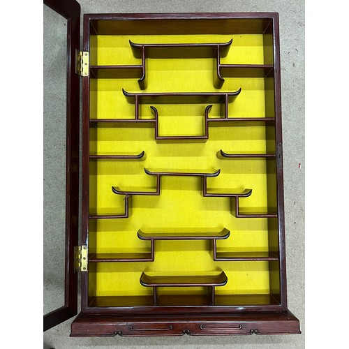 59 - An oriental hardwood wall hanging display cabinet. 82cm x 54cm.