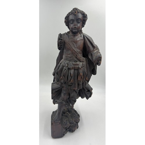 1327 - A carved wooden figure of a Roman soldier, possibly 16thC Spanish Colonial. 57cm h.