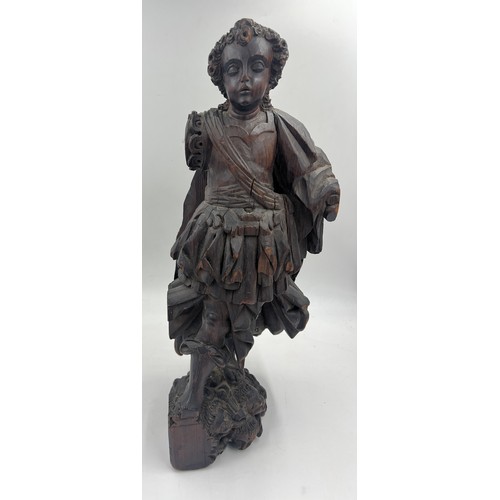 1327 - A carved wooden figure of a Roman soldier, possibly 16thC Spanish Colonial. 57cm h.