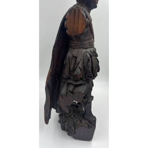 1327 - A carved wooden figure of a Roman soldier, possibly 16thC Spanish Colonial. 57cm h.