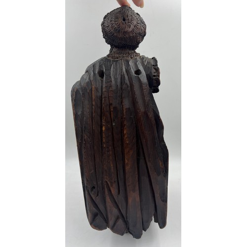 1327 - A carved wooden figure of a Roman soldier, possibly 16thC Spanish Colonial. 57cm h.