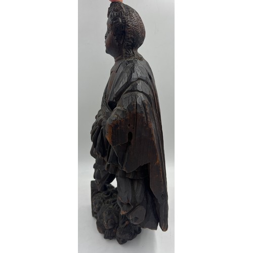 1327 - A carved wooden figure of a Roman soldier, possibly 16thC Spanish Colonial. 57cm h.