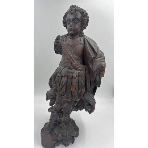 1327 - A carved wooden figure of a Roman soldier, possibly 16thC Spanish Colonial. 57cm h.