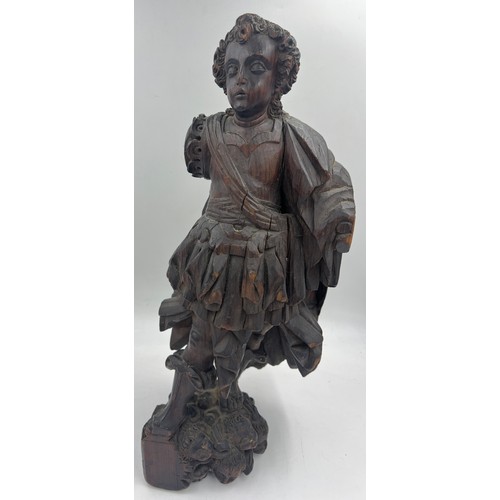 1327 - A carved wooden figure of a Roman soldier, possibly 16thC Spanish Colonial. 57cm h.