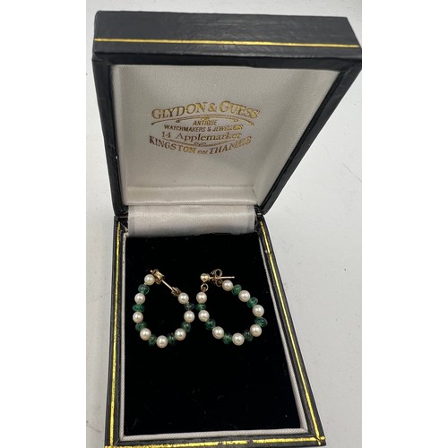 604 - Pearl and emerald loop earrings with 9 carat gold posts and backs.