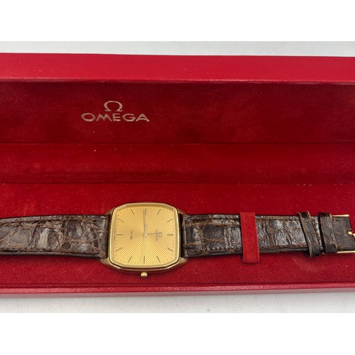 723 - A gentleman’s Omega De Ville wristwatch with square face and leather strap in original box.