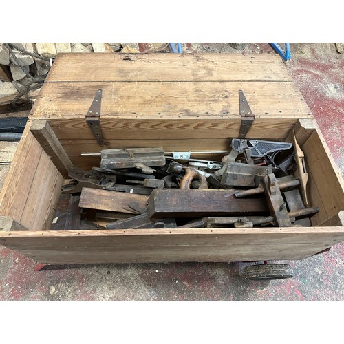 1329 - A quantity of vintage tools to include 2 drilling machines and a pine chest of planes etc.