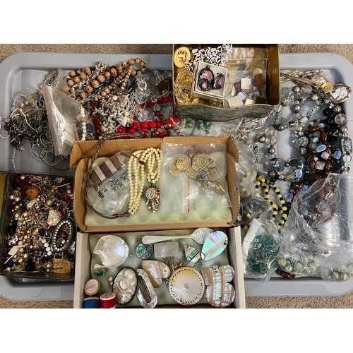 571 - A quantity of late 19th and early 20thC jewellery to include  beads, brooches etc.