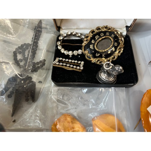 573 - An interesting lot of mainly 19thC jewellery etc to include amber, lava cameo bracelet, mourning bro... 