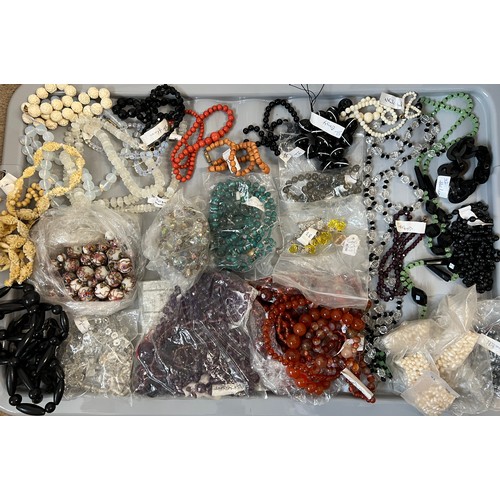 575 - A quantity of loose and threaded bead necklaces to include garnet, pearl, glass, bone, onyx etc.