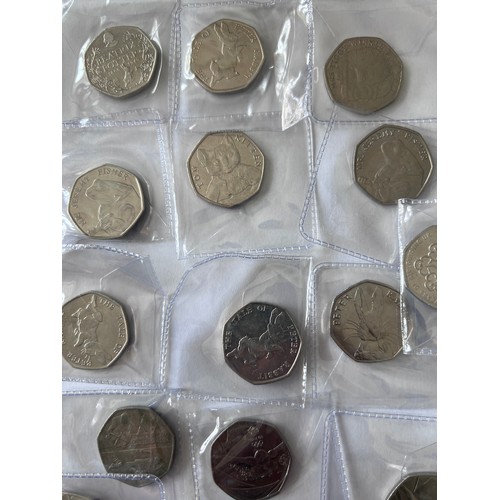 735 - A quantity of fifty pence pieces to include WWF, Battle of Hastings, Beatrix Potter, 2012 Olympic et... 