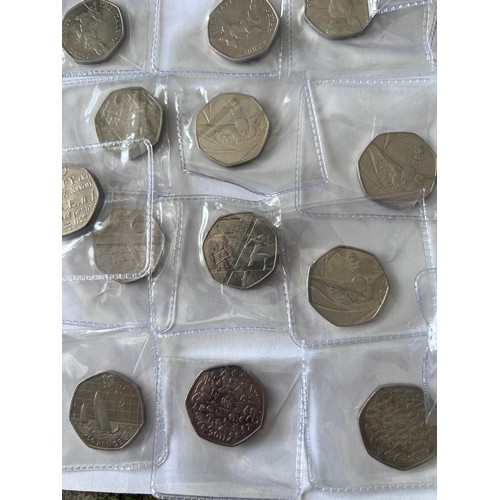 735 - A quantity of fifty pence pieces to include WWF, Battle of Hastings, Beatrix Potter, 2012 Olympic et... 