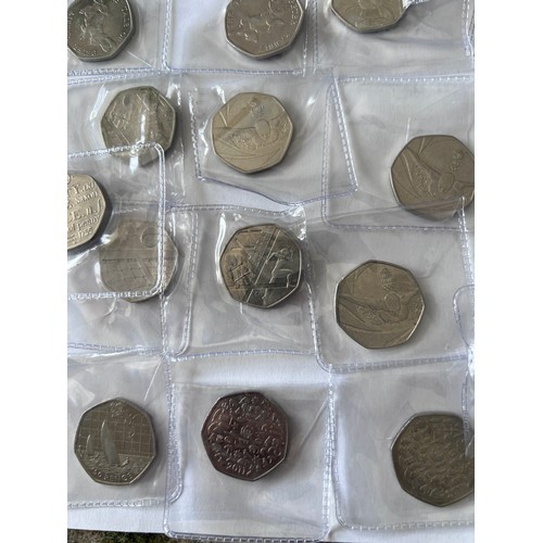 735 - A quantity of fifty pence pieces to include WWF, Battle of Hastings, Beatrix Potter, 2012 Olympic et... 