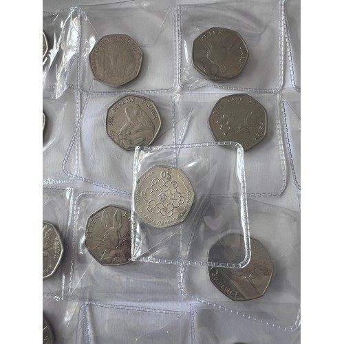 735 - A quantity of fifty pence pieces to include WWF, Battle of Hastings, Beatrix Potter, 2012 Olympic et... 