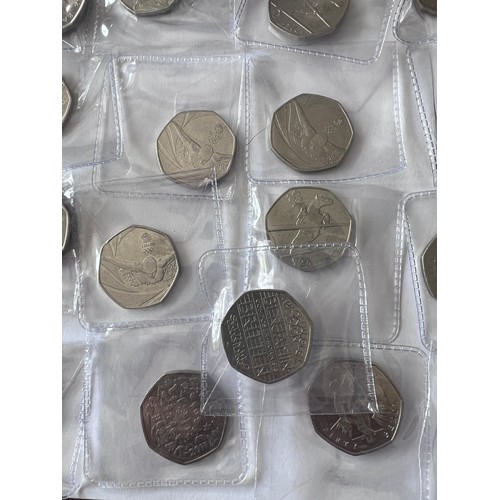 735 - A quantity of fifty pence pieces to include WWF, Battle of Hastings, Beatrix Potter, 2012 Olympic et... 