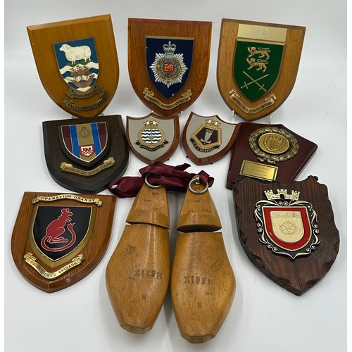 1332 - A collection of various plaques together with a pair of shoe stretches. Plaques include British Mili... 