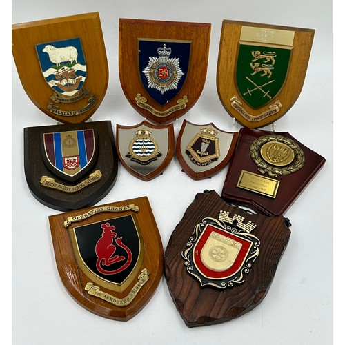 1332 - A collection of various plaques together with a pair of shoe stretches. Plaques include British Mili... 