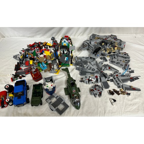 1211 - Lego, an unboxed quantity of loose items to include Star Wars Millennium Falcon, boat, helicopter, j... 