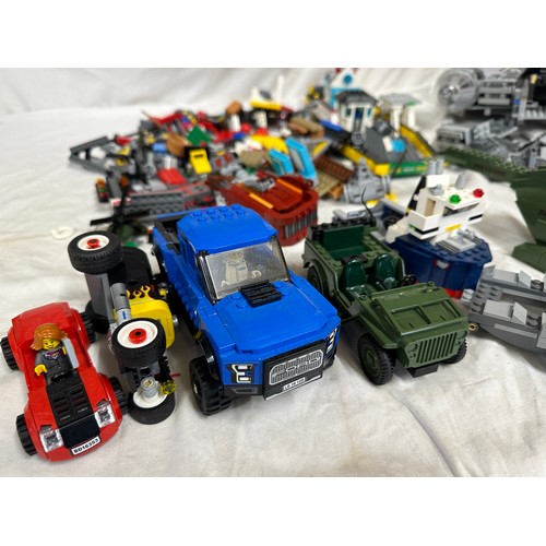 1211 - Lego, an unboxed quantity of loose items to include Star Wars Millennium Falcon, boat, helicopter, j... 