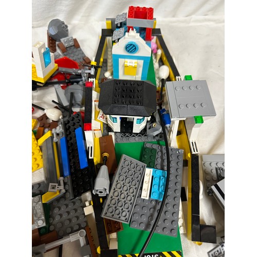 1211 - Lego, an unboxed quantity of loose items to include Star Wars Millennium Falcon, boat, helicopter, j... 