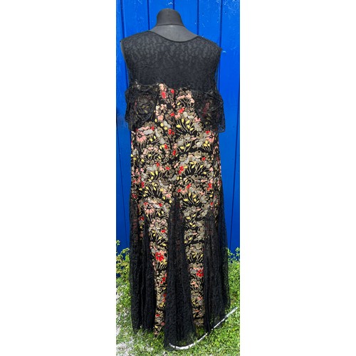 837 - A 1920’s evening dress with black lace panels.