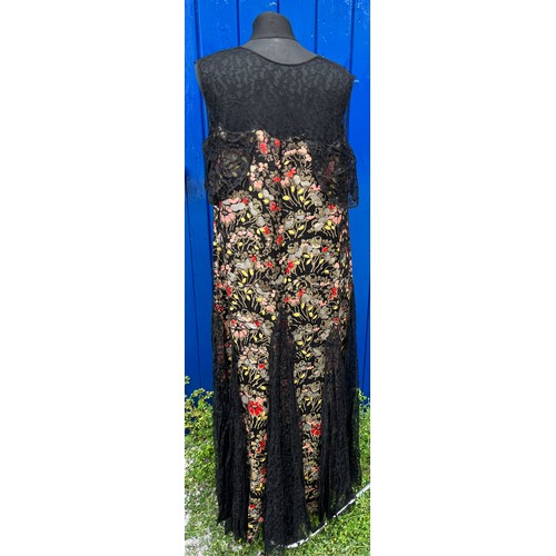 837 - A 1920’s evening dress with black lace panels.