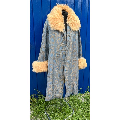 842 - A vintage blue and metallic fabric coat with fur collar and cuffs.