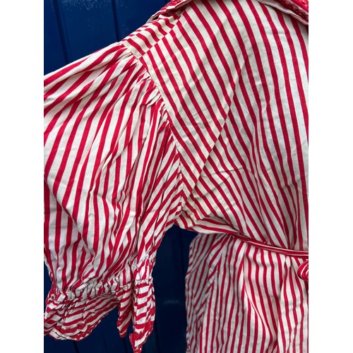 844 - An early 20thC red and white striped bathing costume comprising of top, bloomers, bonnet and belt.