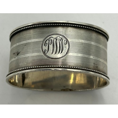 807 - Hallmarked silver to include a Yard of Lead pencil in original box, 3 x napkin rings various dates a... 