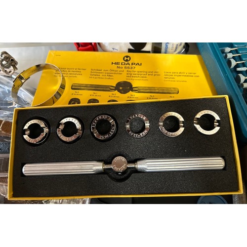 730 - A large quantity of watch repair related items comprising: a selection of leather and stainless watc... 