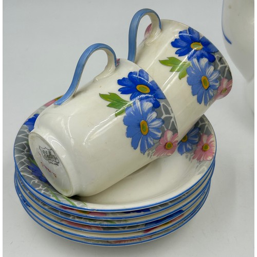 145 - A Shelley Art Deco part coffee set with blue and pink floral decoration, pattern no B.12216 to base ... 