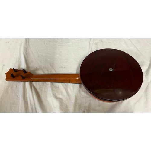 980 - Three ukulele banjos to include a rosewood made in the G.D.R. and a Melody Maker Selcol, Made in Eng... 