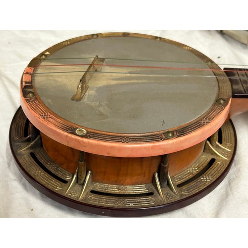 980 - Three ukulele banjos to include a rosewood made in the G.D.R. and a Melody Maker Selcol, Made in Eng... 